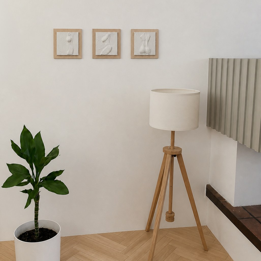Three 15 × 15 cm reliefs on a living room wall