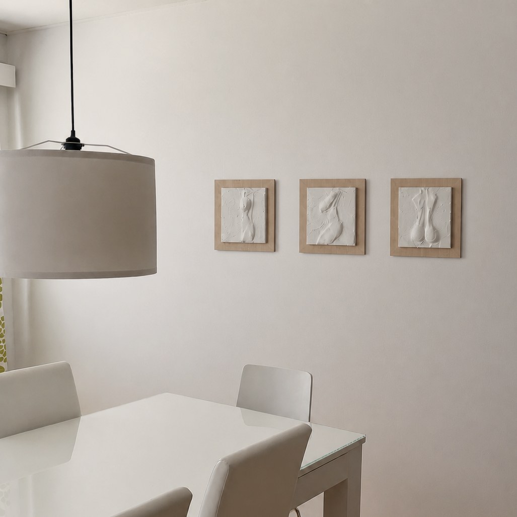 Three 30 × 30 cm reliefs above the dining table